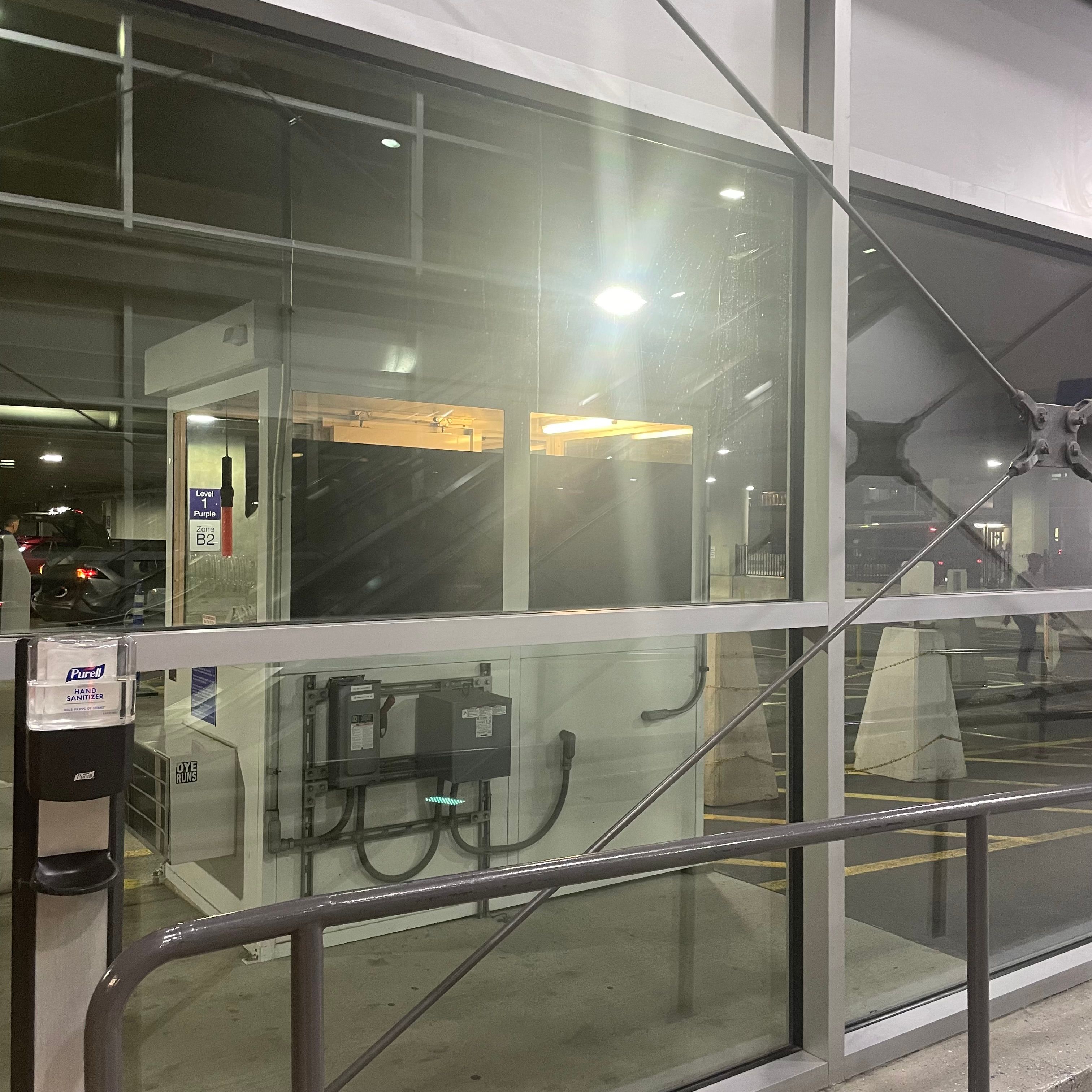 Window with a view of an airport booth.